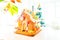 Cute, child-made gingerbread house, with imperfections a real gingerbread house assembly, for the Christmas holiday season, as a