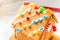 Cute, child-made gingerbread house, with imperfections a real gingerbread house assembly, for the Christmas holiday season, as a