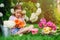 Cute child making flower bouquet in sunny summer garden