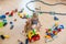 Cute child, playing with colorful toy blocks. Little boy building house of block toys sitting on the floor in sunny spacious