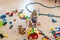 Cute child, playing with colorful toy blocks. Little boy building house of block toys sitting on the floor in sunny spacious