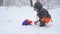 Cute child playing with snow