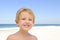Cute child with sunscreen at the beach