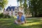 Cute child, toddler boy, eating ice cream in gardens of Azay Le Rideau castle on Loive Valley