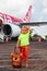 Cute child wait for boarding to plane in International Bali airport
