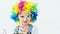 Cute child wearing rainbow wig