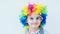 Cute child wearing rainbow wig