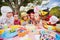 Cute children blowing together on the candle during a birthday party