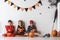 Cute children in costumes ready for trick-or-treating