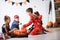 Cute children in costumes ready for trick-or-treating