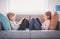 Cute children sitting on the soft sofa and reading books