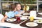 Cute children at table with healthy food