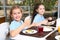 Cute children at table with healthy food