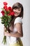 Cute chinese girl happy with roses