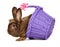 Cute chocolate colored Easter rabbit with a purple basket