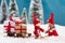 Cute christ child figures bringing presents on wooden sledge