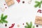 Cute Christmas background with gifts, branches and decorations