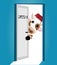 A cute Christmas cow with a red Christmas hat on her head peeks out from behind a half-open door in 2021. 2021 is on the doorstep