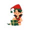 Cute christmas girl elf helper santa claus sit on floor with holiday present.