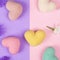 Cute colorful stylish mockup photo with small hearts and flowers. Pastel colored crocheted hearts on pink and lilac paper backgrou