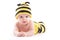 Cute confused baby boy in bee costume