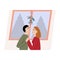 A cute couple on Christmas tree. Man and woman kissing under a mistletoe holding hands and watching in each other eyes.