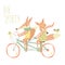 Cute couple foxes ride tandem bicycle