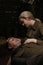 Cute couple in love in military uniform from the second world war man lying and young woman is stroking him
