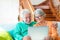 Cute couple of seniors watching movies having fun using laptop at home sitting on the sofa together. Two mature pensioners holding