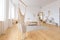 Cute cozy light interior design of the apartment with a free layout of the kitchen and bedroom areas. a lot of windows, a wooden