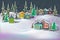Cute cozy night winter landscape caramel multicolored houses and firs in snow drifts.