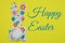 Cute, craft cut-out Easter bunny shape made out of cheerful patterned and colorful paper napkins and a tissue paper tail on a