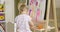 Cute creative little girl artist painting