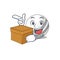 Cute cricket ball cartoon character having a box