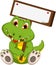Cute crocodile cartoon holding blank board