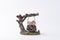 Cute decoration with figures of an elderly cute couple sitting happily on the swing under the tree