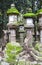 Cute deer and stone lanterns at Kasuga Grand Shrine, Nara Japan