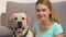 Cute dog and happy young woman looking in camera, pet companionship, best friend