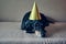 Cute dog in party hat. Happy birthday anniversary. Black brown dachshund portrait celebrating a new year