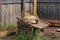 A cute doggie lays on the roof of its wooden kennel.