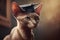 A cute domestic cat wearing a graduating hat