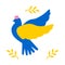 A cute dove of peace in blue and yellow is isolated on a white background and has a pink panama hat on his head.