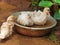 Cute ducklings splashing in a bowl of water outdoors