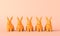 Cute easter bunnny background. Line of colourful rabbits. 3D Rendering