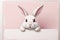 Cute Easter Bunny Banner: Whimsical Design in Pink and White with Generous Copy Space.