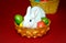 Cute easter bunny in the bowl with eggs