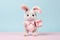 Cute Easter Bunny presenting a gift card - stock picture