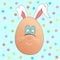 Cute egg rabbit on a blue background with polka dots. Easter holiday. Joyful character for children.