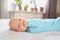 Cute emotional funny newborn infant crying boy laying on bed. Infant baby facial expressions