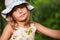 Cute European little girl in colorful Panama hat